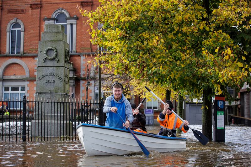 People canoe down a flooded Bank Parade in Newry, Co Down. Photograph: Liam McBurney/PA Wire
