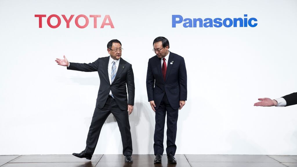 Akio Toyoda, president of Toyota Motor, and Kazuhiro Tsuga, president of Panasonic, at a joint news conference in Tokyo on December 13th, 2017. Photograph: Bloomberg