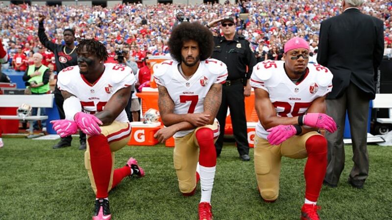 Eli Harold, Colin Kaepernick and Eric Reid of the San Francisco 49ers kneel in protest during the anthem in 2016. Photograph: Getty Images