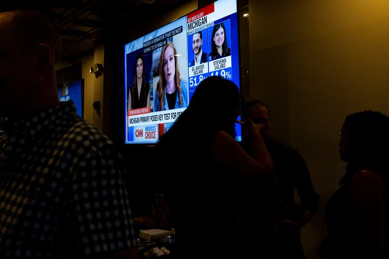A TV broadcasts election results during a primary election night watch party in Detroit.  Photograph: Emily Elconin/Bloomberg