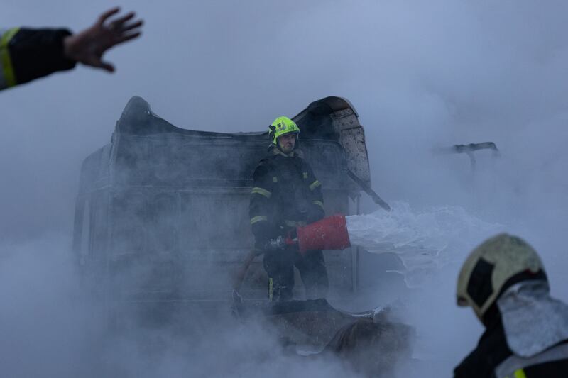 Ukrainian rescuers work to extinguish a fire at the site of a Russian air attack in Kyiv on Saturday. Photograph: Oleksandr Magula/AFP via Getty Images