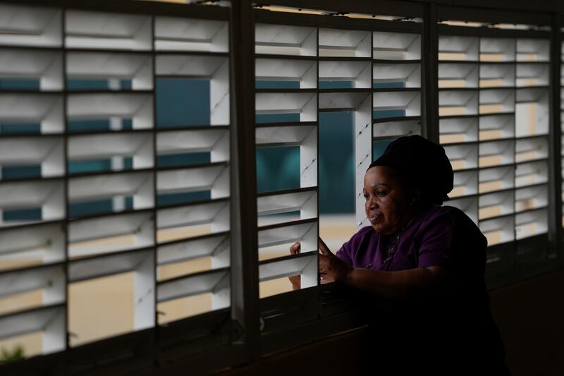 Donna Charles, a hotel cook, watches as Hurricane Beryl passes through Bridgetown, Barbados. Photograph: Ricardo Mazalan/AP
