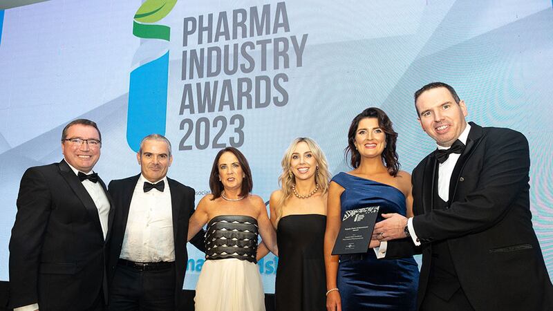 Liam Burke Masterson, business development director at SkyCell, presents the supply chain achievement award to Pfizer Ireland Pharmaceuticals team