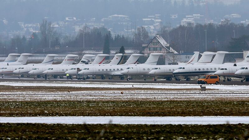 Passenger jets are parked at the Swiss Airforce base in Duebendorf, Switzerland, akin to a carpark for elite WEF participants  Photograph: Reuters