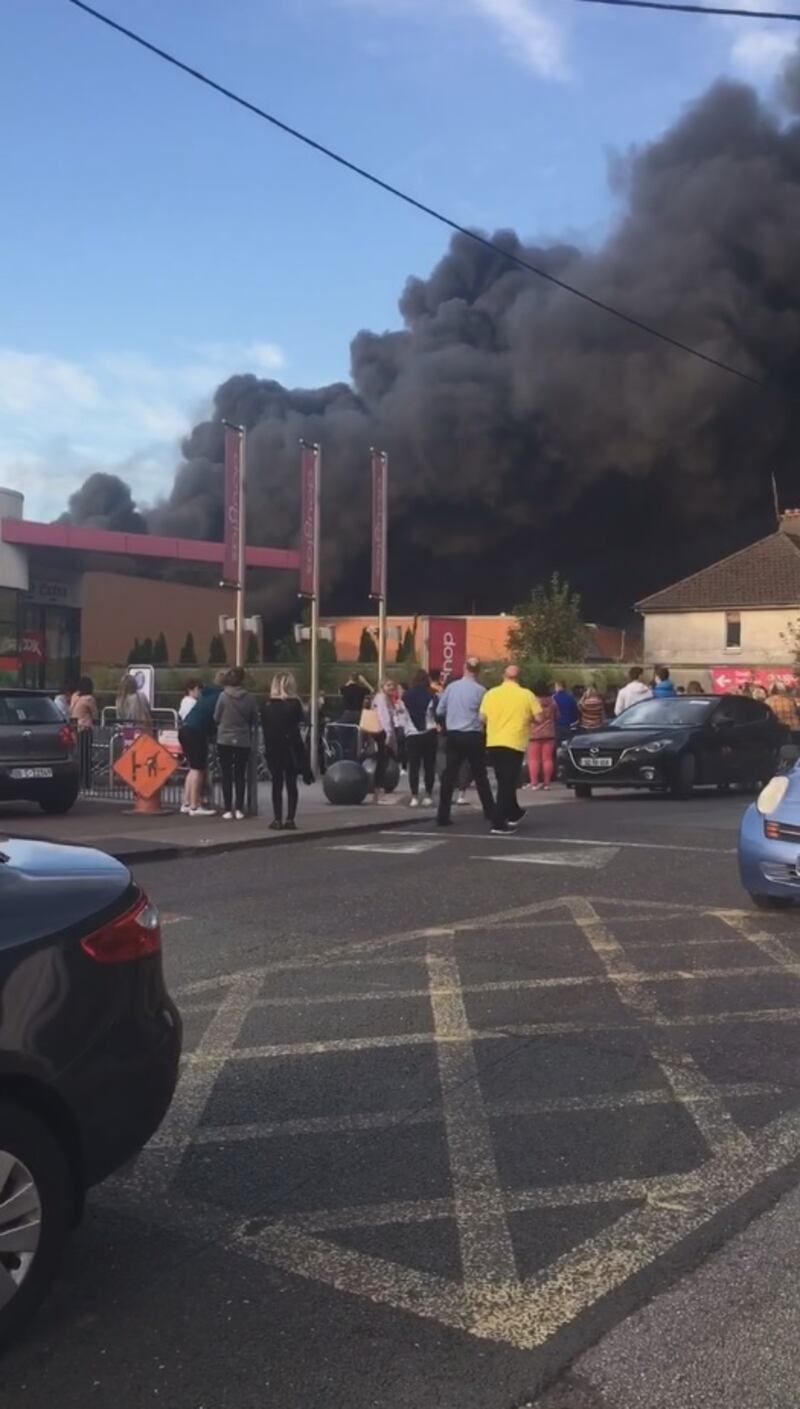 Plumes of smoke coming from the Village Shopping Centre in Douglas, Co Cork. Photograph: Olivia Kelleher