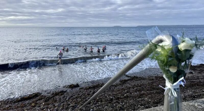 Members of the Salty Souls sea swimmers group in Youghal, Co Cork, who swim 365 days a year, dedicated their gathering on the strand on Tuesday to Ivan Chittenden and Brendan Wall. Photograph courtesy of Orla Riordan 