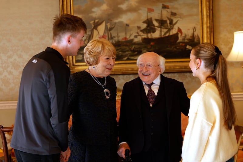 President Higgins and his wife Sabina chat with guests at the final afternoon tea party of the President's term of office. Photograph: Alan Betson