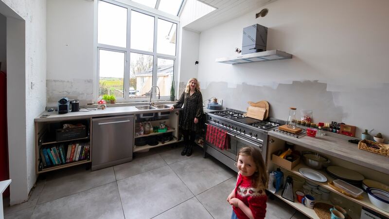 In the work-in-progress kitchen: Amy Walsh and daughter Emmy-Mae. Photograph: Patrick Browne