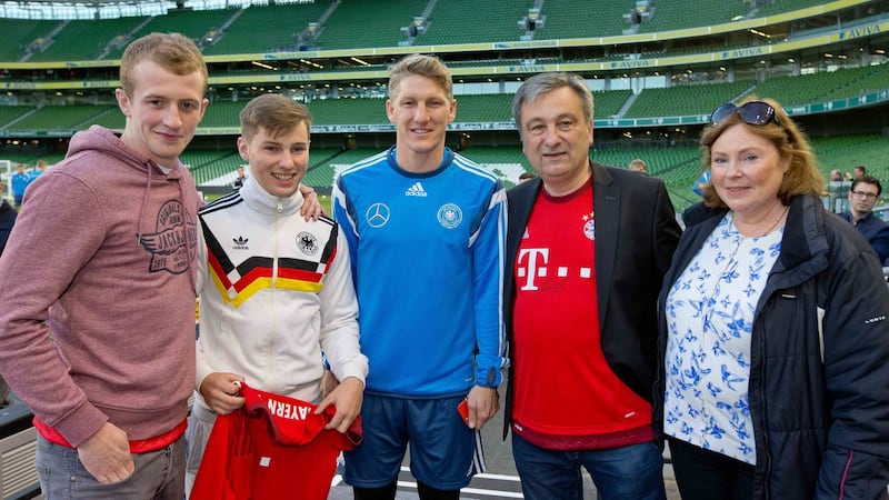 Peter Fitzpatrick, Alexei Schuster, John Schuster and Graziella Schuster meet German footballer Bastian Schweinsteiger during a German training session at the Aviva Stadium. Photograph: Morgan Treacy/Inpho