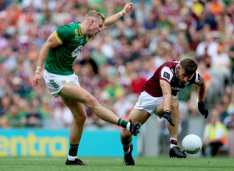 Meath’s Conor Gray scores his side's first goal despite the efforts of Galway's Seán Fitzgerald. Photograph: James Crombie/Inpho