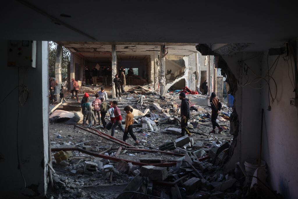 Palestinians check the damage in an area targeted by an Israeli air strike early on December 12th near the Nuseirat refugee in the central Gaza Strip. Photograph: Eyad Baba/AFP via Getty