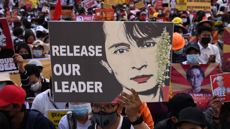 A protester holds a sign calling for the release of detained Myanmar civilian leader Aung San Suu Kyi as they block a road during a demonstration against the military coup in Yangon on Wednesday. Photograph:  Sai Aung Main/AFP/Getty