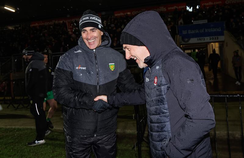 Donegal manager Jim McGuinness congratulates Derry manager  Mickey Harte after the game. Photograph: James Crombie/Inpho