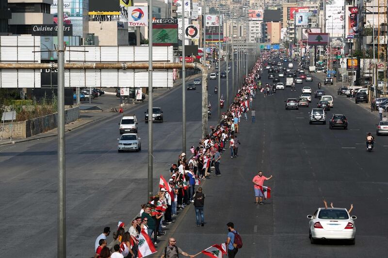 Protesters form human chain across Lebanon as unrest continues
