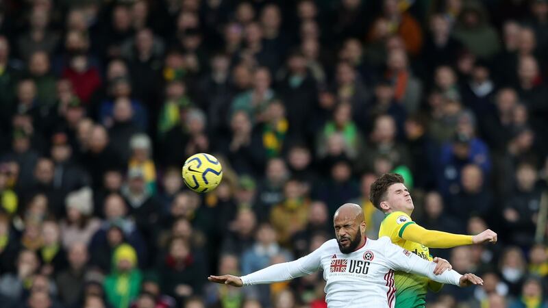 Sheffield United’s David McGoldrick battles for possession  with Sam Byram of Norwich City. Photograph: Naomi Baker/Getty Images