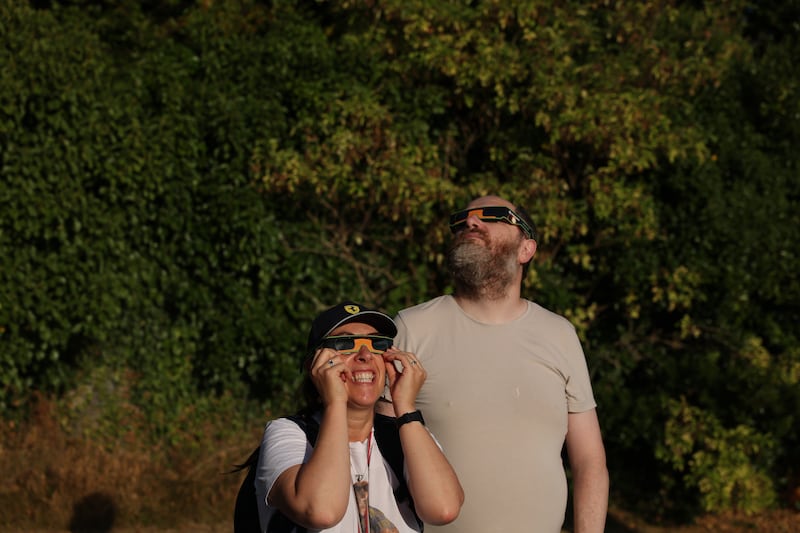 People wear special eclipse glasses at Dunsink Observatory on Thursday. Photograph: Clodagh Kilcoyne
