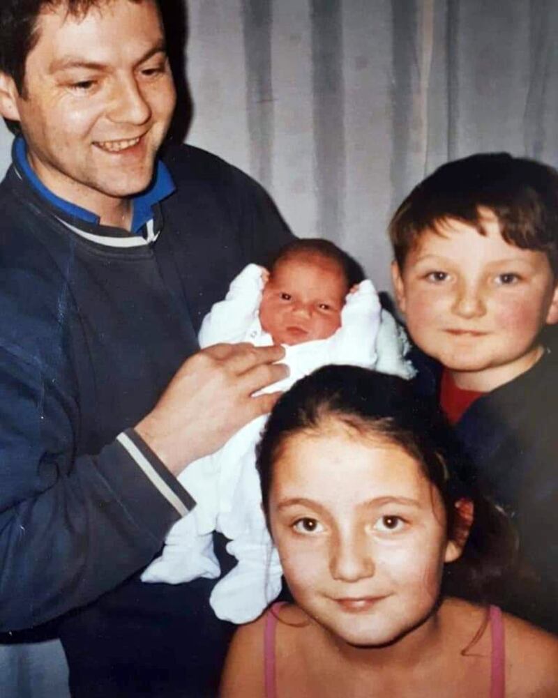 Oweney Cull holding baby Brian, the youngest of the family, with James on the right and Leah in front. James died by suicide last August, five years after his father.