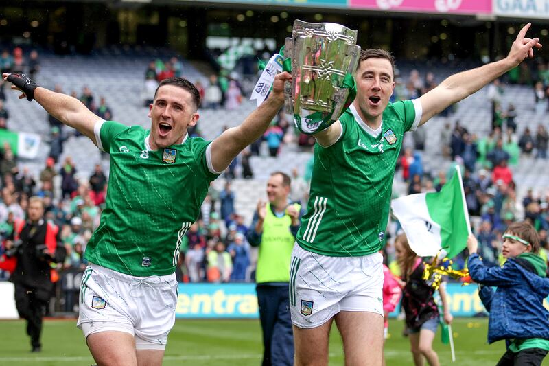 Limerick's Darragh O'Donovan and Diarmaid Byrnes celebrate with the Liam MacCarthy Cup after Sunday's final win over Kilkenny. Photograph: Laszlo Geczo/Inpho
