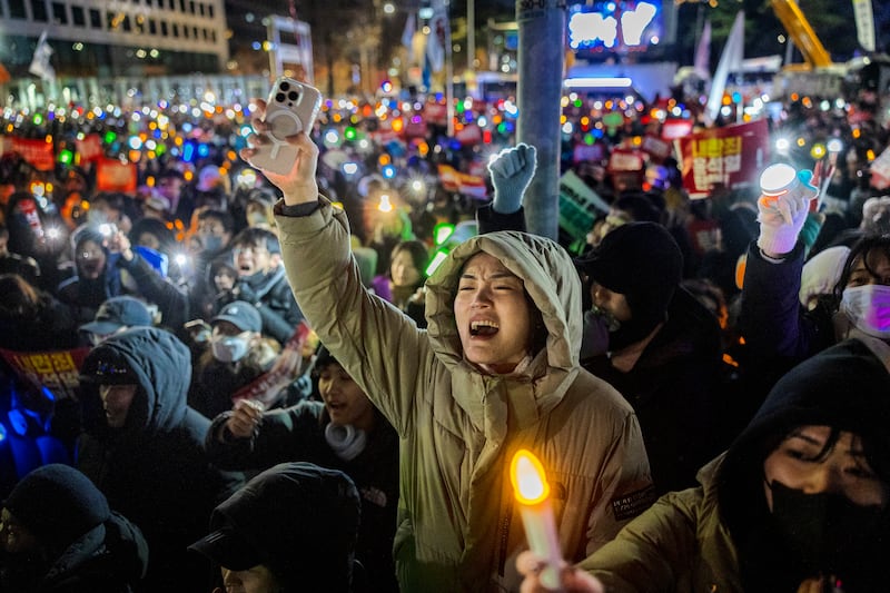 Protesters take part in a demonstration last December in Seoul against Yoon Suk Yeol, then president. Photograph: Ezra Acayan/Getty