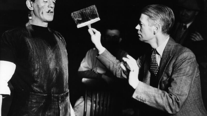 Boris Karloff with cigarette is dirtied by director James Whale in between scenes from the film ‘Frankenstein’, 1931. Photograph:  Universal/Getty Images