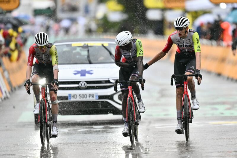 Biniam Girmay (centre) crosses the finish line with his team-mates, nursing injuries after a crash near the end of Wednesday's 17th stage. Photograph: Marco Bertorello/AFP via Getty Images