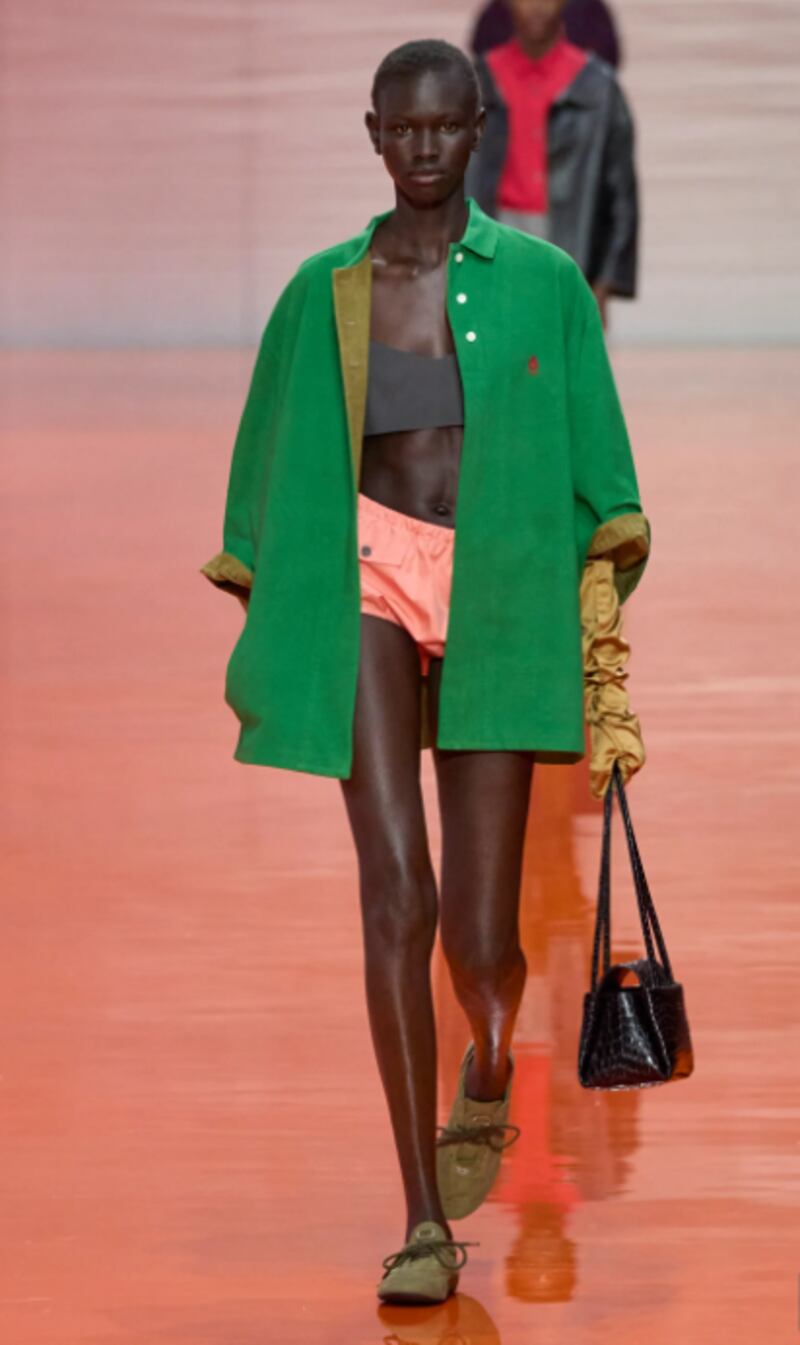 Green sporty jacket and short shorts by Prada