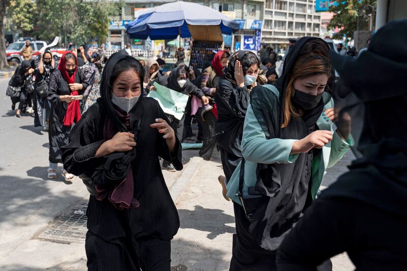 Taliban fighters fire in air to disperse Afghan women protesters in Kabul on Saturday. Photograph: Wakil Kohsar/AFP via Getty Images