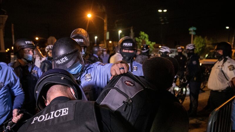 Police  detain protesters demonstrating against the killing of Walter Wallace jnr who are in violation of the 9pm curfew in Philadelphia, on Wednesday.  Photograph: Victor J Blue/The New York Times