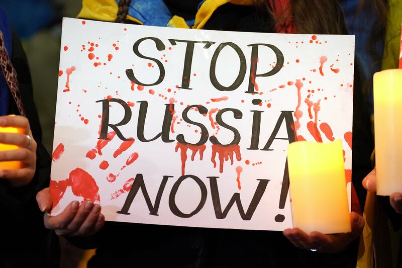 A person holding a sign outside the Russian embassy in Bayswater, central London, in a demonstration to mark the one year anniversary of the Russian invasion of Ukraine. Photograph: Kirsty O'Connor/PA