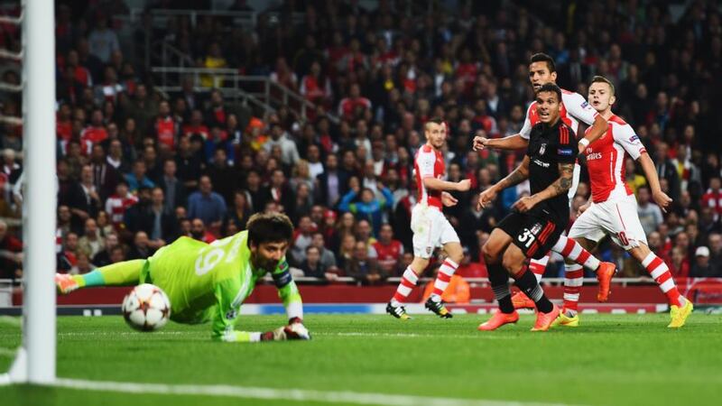 Alexis Sanchez (2nd right) of Arsenal shoots and scores past Tolga Zengin of  Besiktas   at the Emirates Stadium. Photograph:  Shaun Botterill/Getty Images