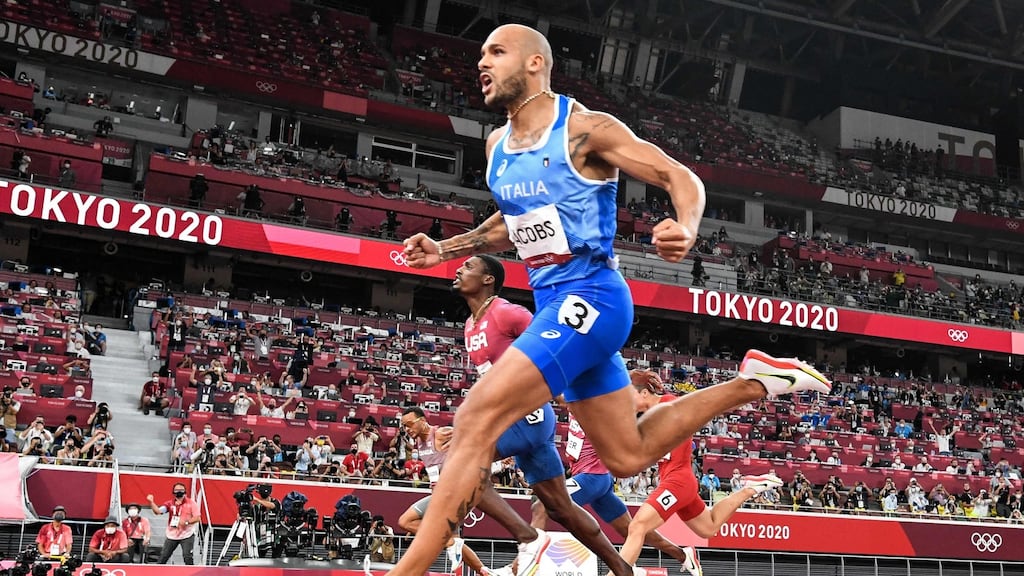 Italy’s Lamont Marcell Jacobs celebrates as he crosses the finish line to win the men’s 100m final at the Olympic Stadium. Photograph: Jewel Samad/AFP via Getty Images