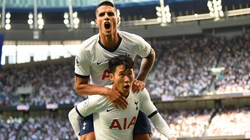 Tottenham Hotspur’s   Son Heung-Min   celebrates with  Erik Lamela after he scores the team’s first goal during the  Premier League  match against  Crystal Palace  at Tottenham Hotspur Stadium. Photograph:  Daniel Leal-Olivas/AFP/Getty Images
