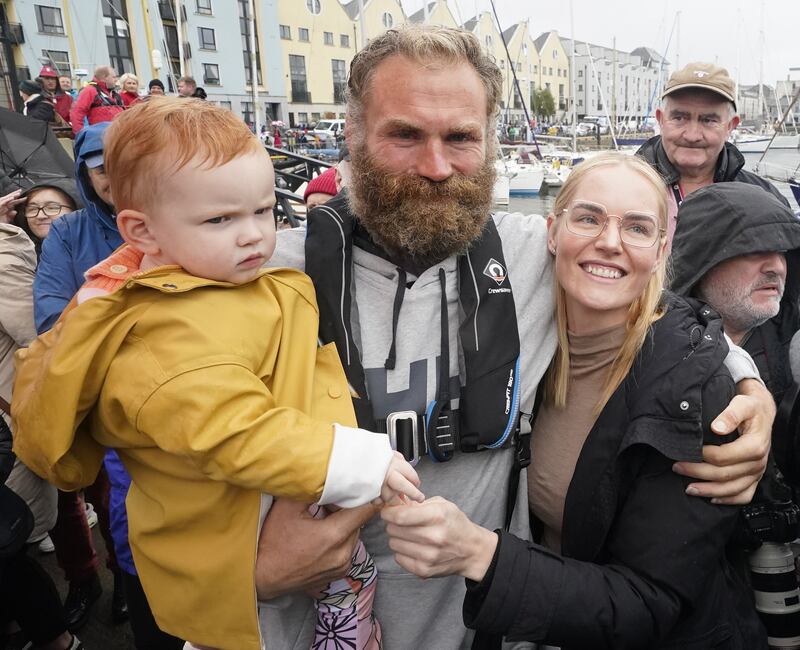 Damian Browne is greeted by his partner Rozelle Bothma and daughter Elodie as he arrives in Galway. Photograph: Niall Carson/PA