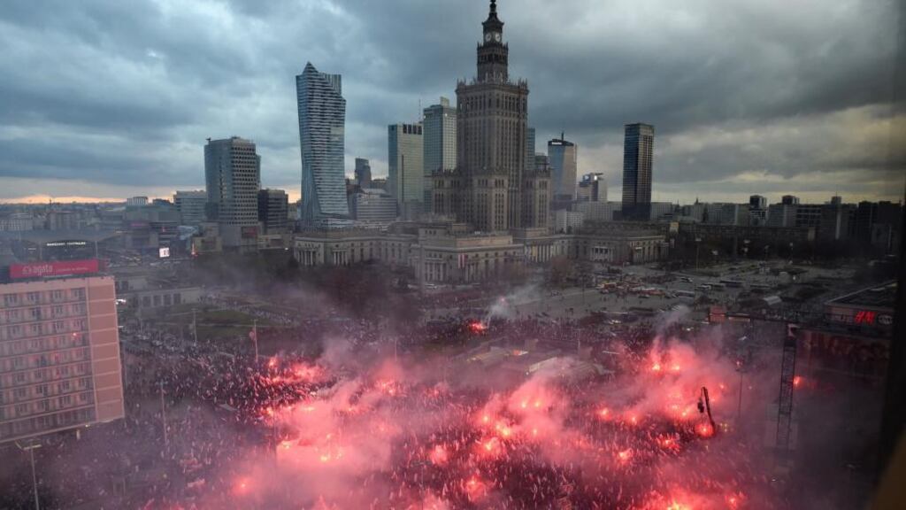 Polish nationalists lit flares as they took part in a demonstration under the slogan ‘We want God’ as part of Polish Independence Day celebrations in Warsaw on Saturday. Photograph: Radek Pietruszka/EPA