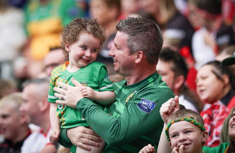 Donegal supporter Clodagh Strain celebrates a score with her dad Patrick. Photograph: Tom Maher/Inpho