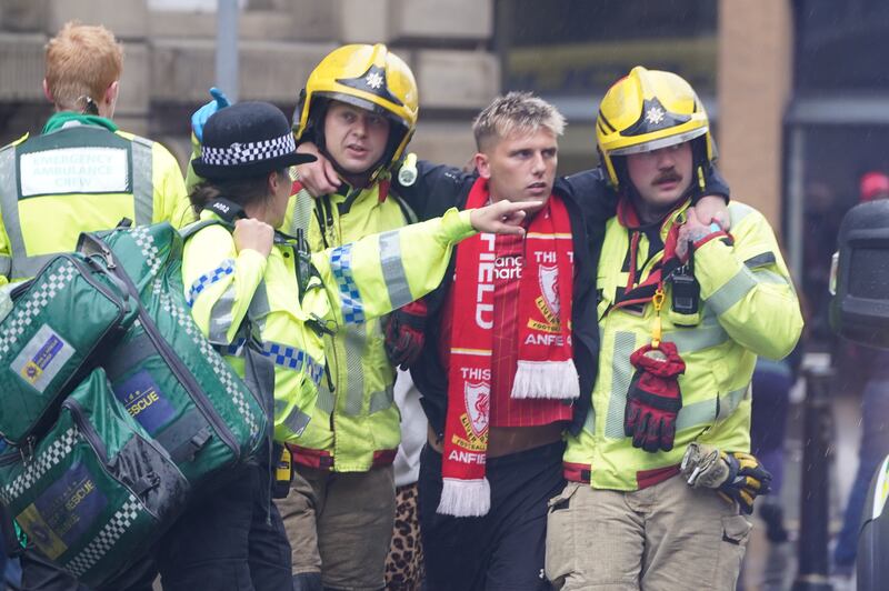 A man is helped by emergency services following the incident. Photograph: Owen Humphreys/PA Wire 