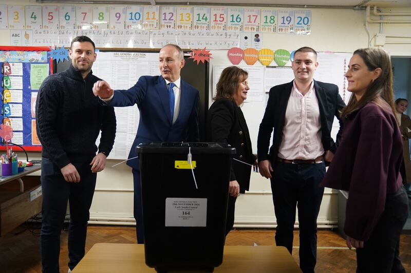 Tanaiste  and Fianna Fail leader Micheal Martin, accompanied by his family, casts his vote at St Anthony's Boys' School, Beechwood Park, Ballinlough, Cork. Jacob King/PA Wire