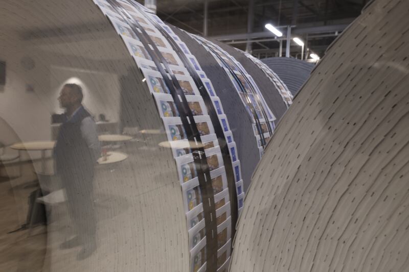 Thousands of supplements and magazines in giant spools awaiting insertion into newspapers.  Photograph: Nick Bradshaw