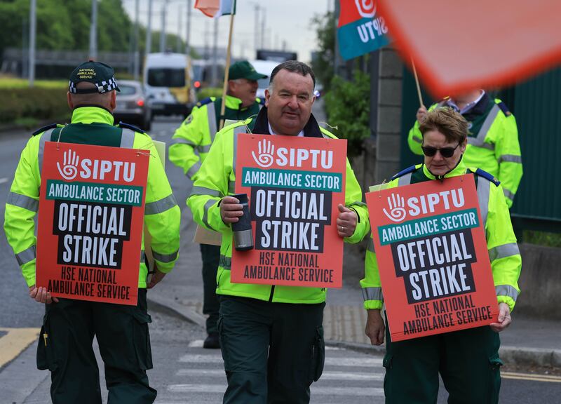 Domhnaill Joyce with members of the National Ambulance Service on the picket line this morning at the National Ambulance Service headquarters on Davitt Road. Photograph: Colin Keegan/Collins