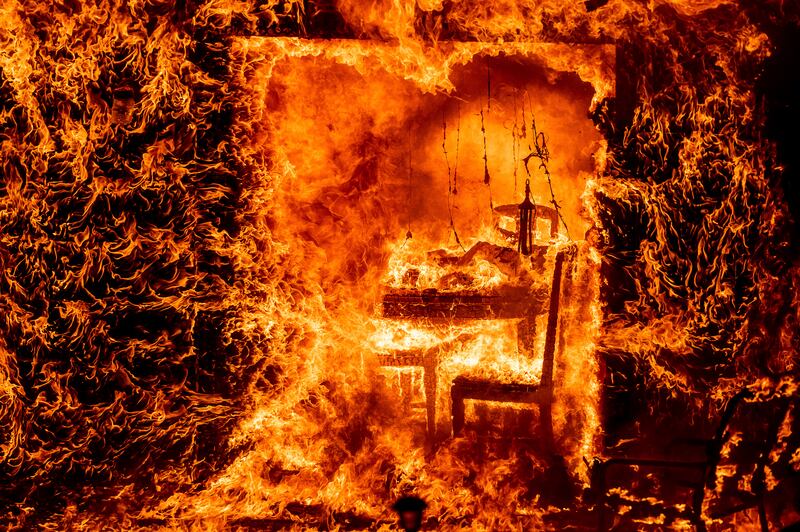 Flames from the Oak Fire consume a home in Mariposa County, California. Photograph: Noah Berger/AP