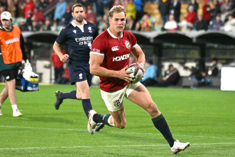 British and Irish Lions' Duhan van der Merwe runs the ball for a try. Photograph: Brenton Edwards/AFP via Getty