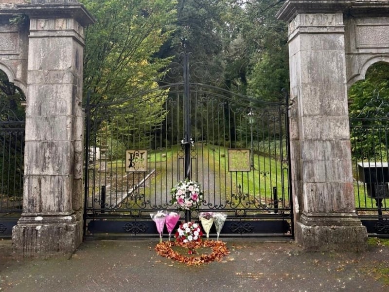 Flowers are left at the gates of Castlehyde in Fermoy, Co Cork, following the death of Niamh Flatley, wife of Michael Flatley. Photograph: Olivia Kelleher