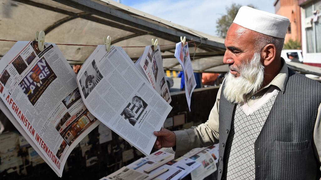 A man reads a local newspaper showing a photograph of newly elected US president Joe Biden, in Kabul, on Sunday. Photograph: Getty Images