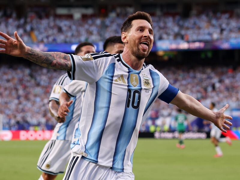 Lionel Messi of Argentina celebrates scoring his team's first goal against Algeria. Photograph: Charlotte Wilson/Getty