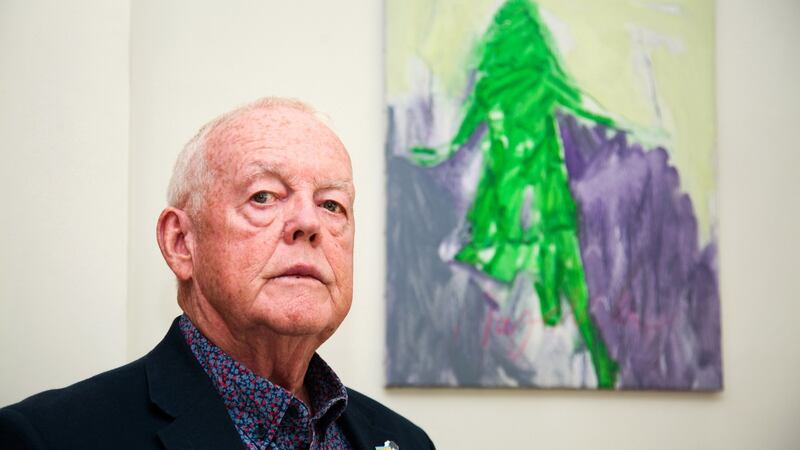 Michael O'Hare standing in front of a painting of his sister by artist Paddy McCann. Photograph: Joanne O'Brien