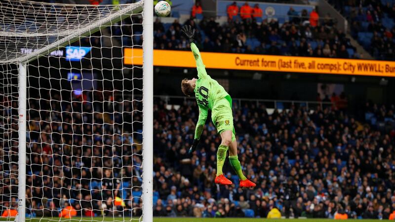 Bradley Collins watches as  Oleksandr Zinchenko’s shot flies over his head for City’s fourth. Photo: Phil Noble/Reuters