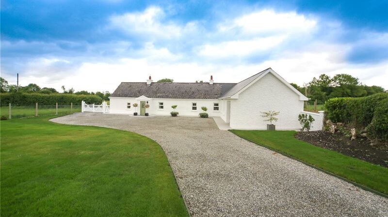Priced at €275,000, this cottage at Ballytarsna extends to 155sq m and sits on a half an acre of landscaped grounds.