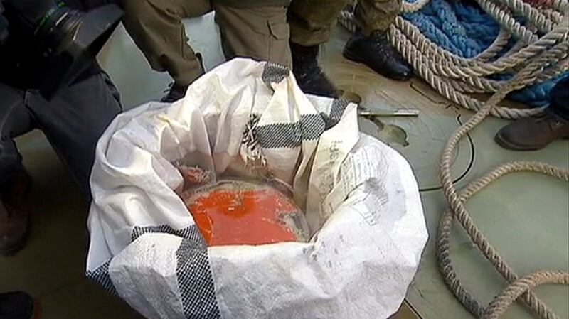 A retrieved flight recorder of the crashed Russian jet on a pier just outside Sochi, Russia. Screengrab: Rossiya One TV Channel photo/AP