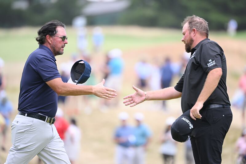 Phil Mickelson shakes hands with Shane Lowry after the second round  of the US Open at The Country Club in Brookline, Massachusetts. Photograph: Ross Kinnaird/Getty Images