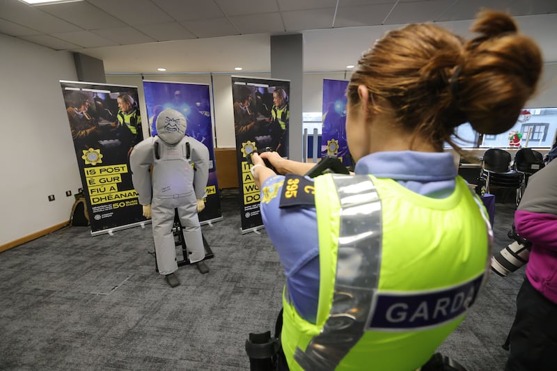 Garda Kelly Smyth demonstrating the use of a Taser. Photograph: Alan Betson

